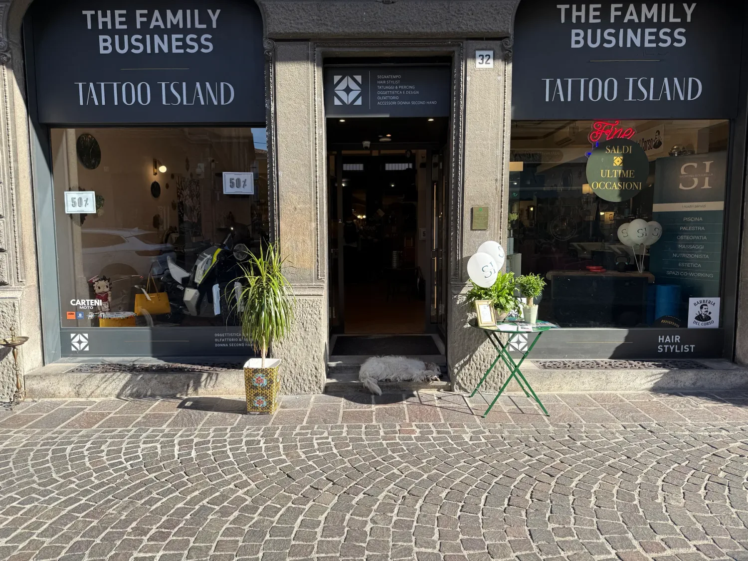The entrance to Tattoo Island under The Family Business sign, on Corso Umberto I in Lodi.