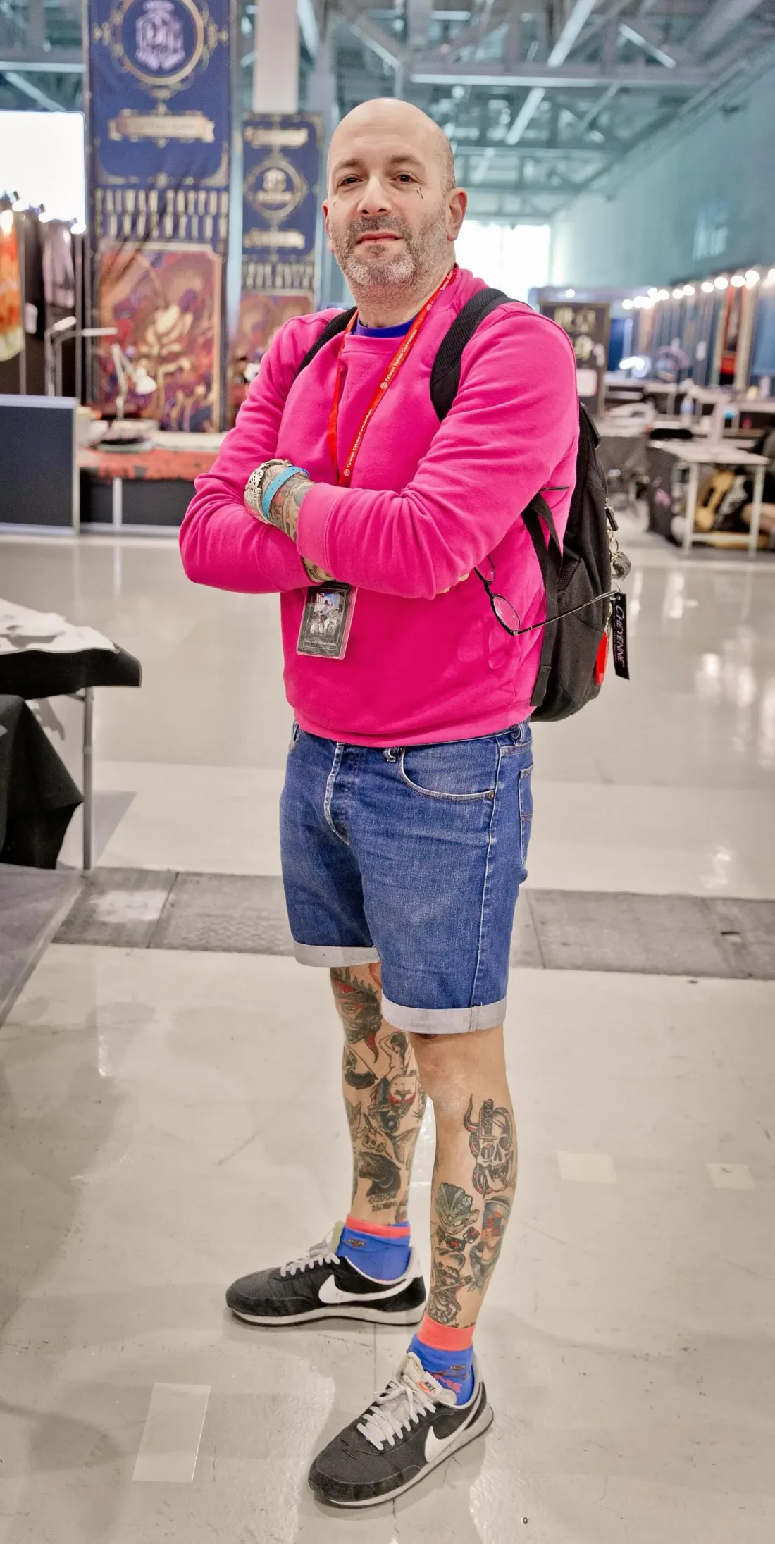 Alessandro Pennella with his backpack, in a convention hall.